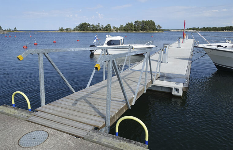 Long jetty with two moored boats.