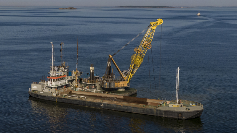 Dredger and barge at sea.