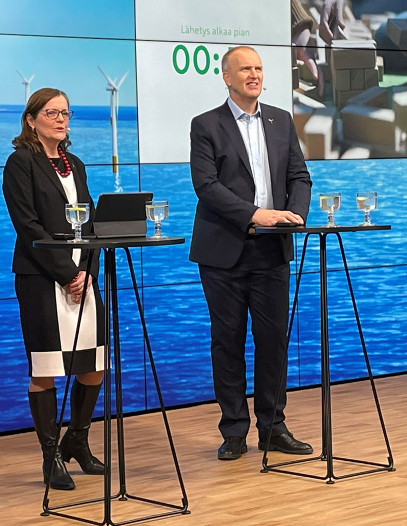 A woman and a man holding a press conference