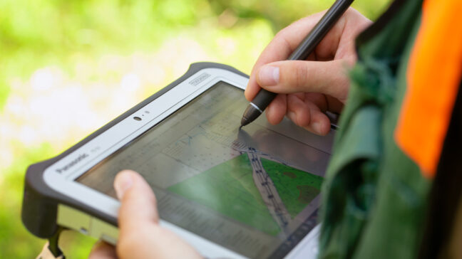 Person working with a tablet.